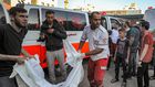 The body of a victim killed in an Israeli bombardment is taken out of an ambulance in Gaza City.DAWOOD NEMER/AFP via Getty Images