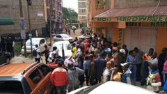 A crowd outside the building where a woman was found dead in an apartment reported to be an airbnb in Roysambu
