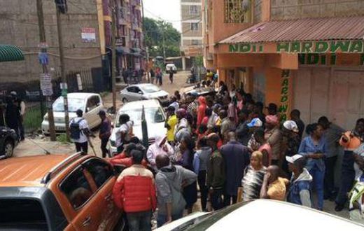 A crowd outside the building where a woman was found dead in an apartment reported to be an airbnb in Roysambu