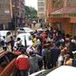 A crowd outside the building where a woman was found dead in an apartment reported to be an airbnb in Roysambu