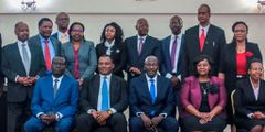Attorney General Justin Muturi (seated second left) and Justice Erik Ogolla (centre) joined by members of the commission of inquiry into the Shakahola cult deaths at Milimani Law Court on May 9, 2023.