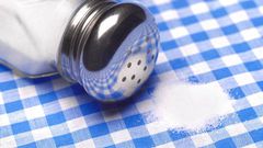 Close up of a pile of salt on a table cloth