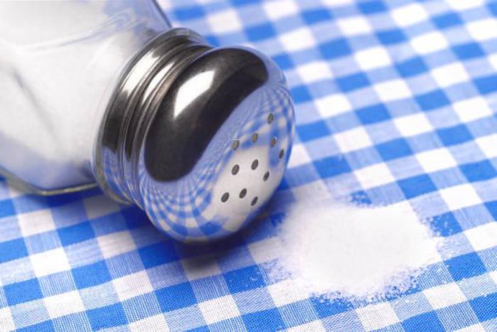 Close up of a pile of salt on a table cloth