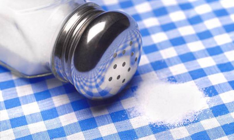 Close up of a pile of salt on a table cloth