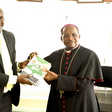 PS Julius Bitok hands over copies of Digital ID FAQ booklet to Kenya Conference of Catholic Bishops chairman Archbishop Martin Kivuva
