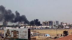 Heavy smoke bellows above buildings in the vicinity of the Khartoum's airport on April 15, 2023, amid clashes in the Sudanese capital.AFP/Getty Images