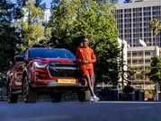 Eliud Kipchoge models with the Eliud Kipchoge 1:59 Limited Edition Isuzu D-Max