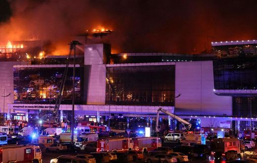 A giant blaze is seen over Crocus City Hall in Moscow after several gunmen burst into a concert hall and fired at the crowd on Friday, March 22, 2024 [Courtesy]
