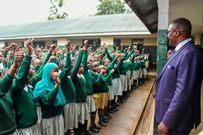 Cabinet Secretary for Information, Communication and the Digital Economy Eliud Owalo with learners from Ndurarua Primary Primary School in Dagoreti Sub-County, during the 2022 KCPE and KEPSEA national exams on November 29, 2022