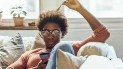 Young woman using smart phone at home
