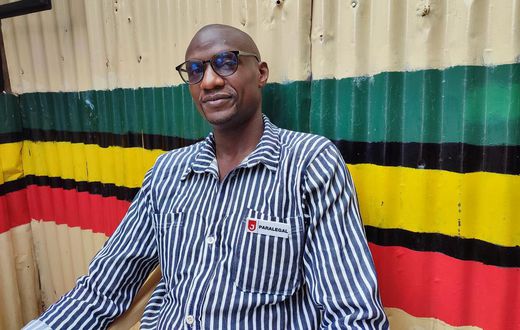 Moses Dola in his prison outfit
