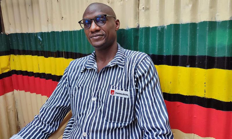 Moses Dola in his prison outfit