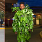 Kenyan comedian Eric Omondi in a hair suit and a camouflage leaf suit