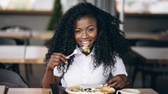 Lady eating food for good mood