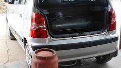 A car fitted with cooking gas cylinder