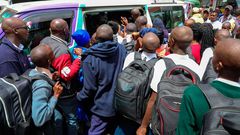 Students scrambling to board a matatu