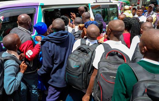 Students scrambling to board a matatu