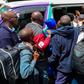 Students scrambling to board a matatu