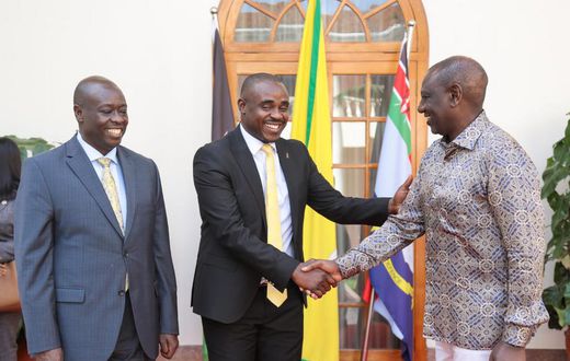 President William Ruto greets UDA Sec Gen Cleophas Malala as Deputy President Rigathi Gahchagua looks on at State House, Nairobi