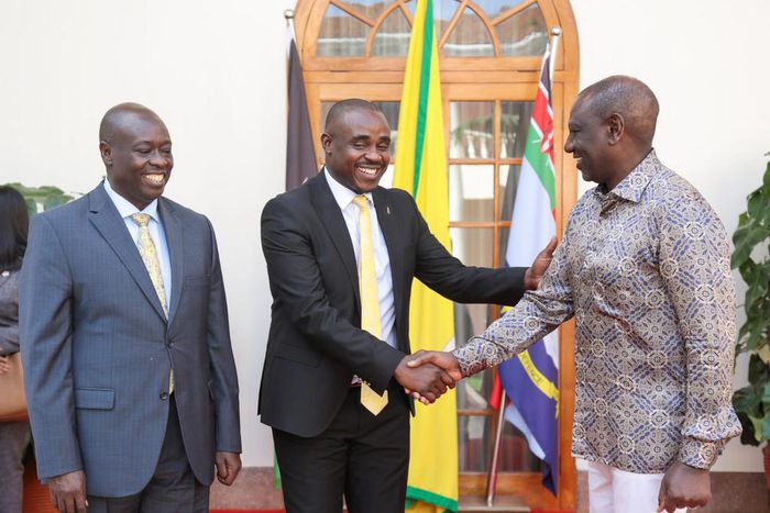 President William Ruto greets UDA Sec Gen Cleophas Malala as Deputy President Rigathi Gahchagua looks on at State House, Nairobi