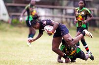 Mwamba's Janet Okello (left) charge past Top Fry Nakuru Ann Akinyi during the Kenya Cup Women league match played at Impala Club on November 27, 2021. Photo/CHRIS OMOLLO