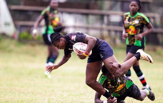 Mwamba's Terry Ayesa (centre) and Janet Okello (left) charge past Top Fry Nakuru Ann Akinyi during the Kenya Cup Women league match played at Impala Club on November 27, 2021. Photo/CHRIS OMOLLO
