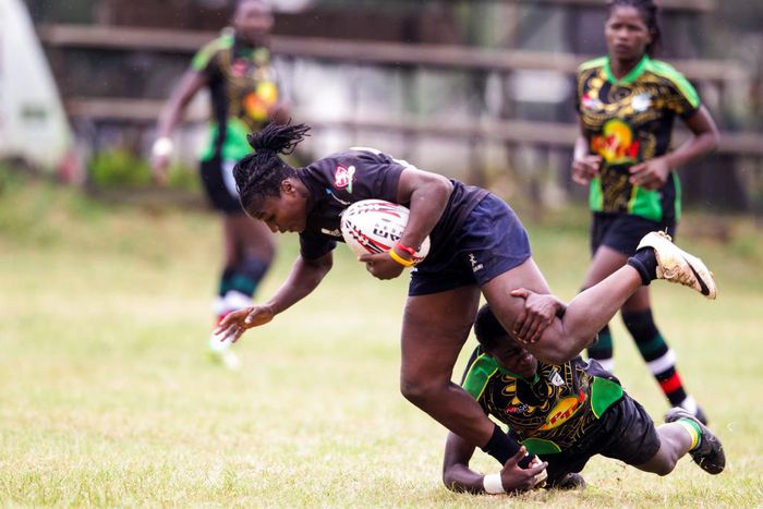 Mwamba's Terry Ayesa (centre) and Janet Okello (left) charge past Top Fry Nakuru Ann Akinyi during the Kenya Cup Women league match played at Impala Club on November 27, 2021. Photo/CHRIS OMOLLO