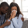 File photo: Man consoles weeping woman (Source: Shutterstock)