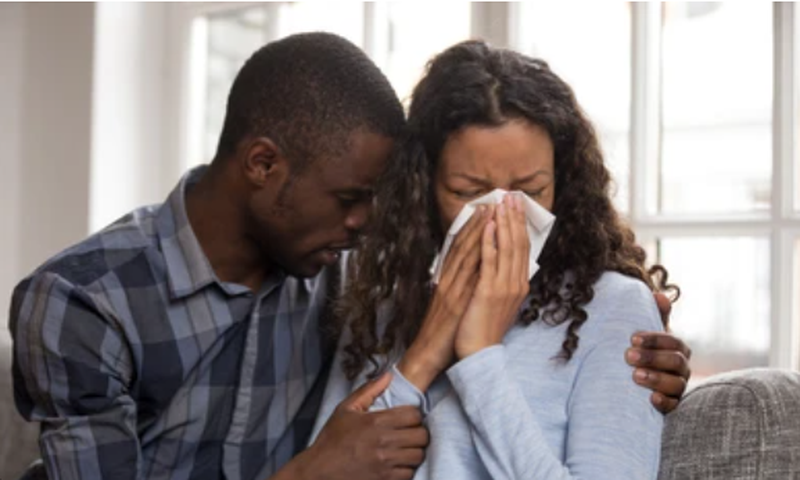File photo: Man consoles weeping woman (Source: Shutterstock)