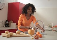 A lady using the kitchen