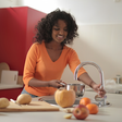 A lady using the kitchen