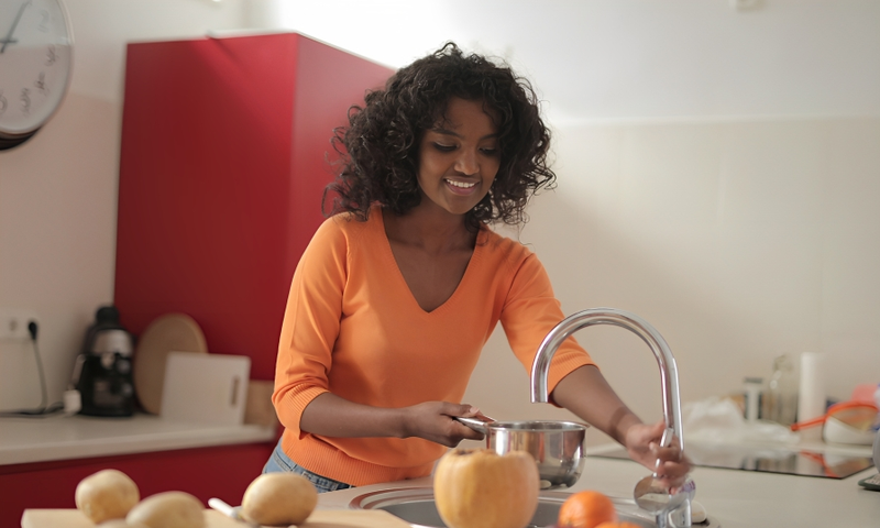 A lady using the kitchen