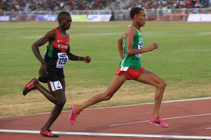 Kenyan Gilbert Kwemoi (Left) and Ethiopian Bekele Ayele Demoz run during the 12th African Juniors Athletics Championships in Addis Ababa, Ethiopia, on March 6, 2015. (Photo by Orhan Karsli/Anadolu Agency/Getty Images)