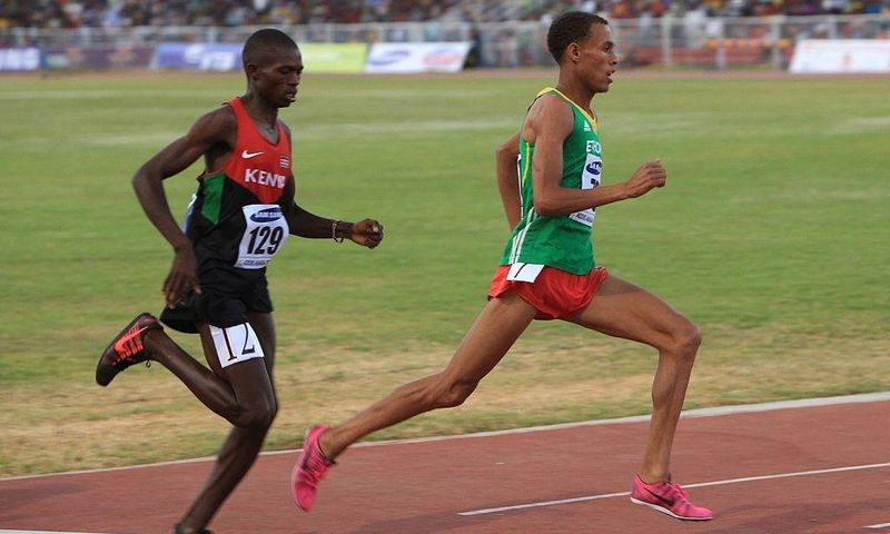 Kenyan Gilbert Kwemoi (Left) and Ethiopian Bekele Ayele Demoz run during the 12th African Juniors Athletics Championships in Addis Ababa, Ethiopia, on March 6, 2015. (Photo by Orhan Karsli/Anadolu Agency/Getty Images)