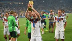 Germany forward Andre Schuerrle holds up the World Cup trophy in Rio de Janeiro after Germany won the final of Brazil 2014.