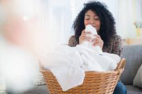 Woman folding white laundry