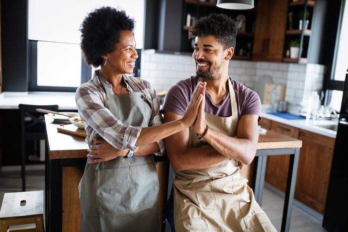 mother and adult son in the kitchen