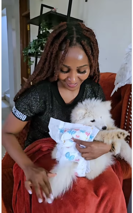 A screengrab of Zora actress Brenda Mitchell detailing how to diaper and comfort a dog who is menstruating