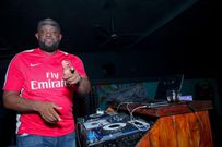 Radio presenter and Dj Gmoney entertaining guests during the Guinness brightestmatchday made by the fans at Bar Next Door, Kiambu Road