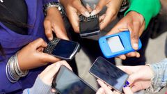 People using their smart phones (Twitter)
