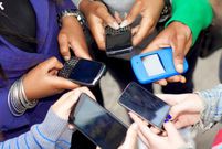 People using their smart phones (Twitter)