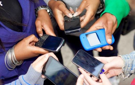 People using their smart phones (Twitter)