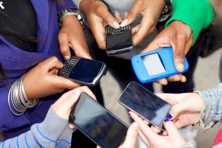 People using their smart phones (Twitter)
