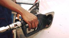 An attendant pumps fuel into a car