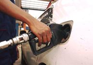 An attendant pumps fuel into a car