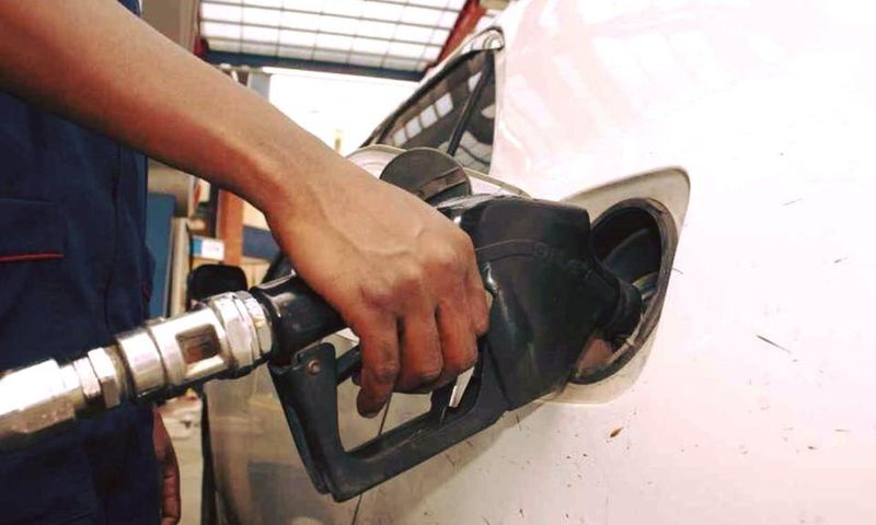 An attendant pumps fuel into a car