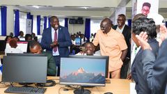 President William Ruto with a Remotasks user Brian Kipchumba at Kaiboi National Polytechnic