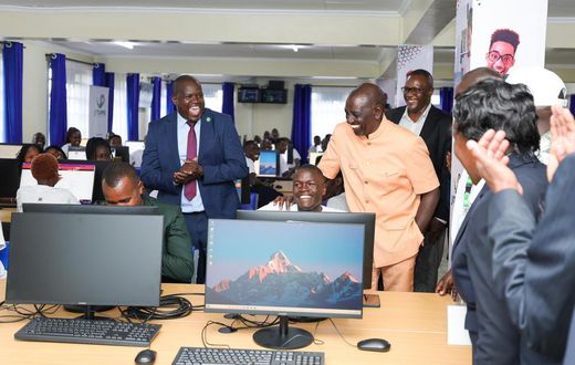 President William Ruto with a Remotasks user Brian Kipchumba at Kaiboi National Polytechnic