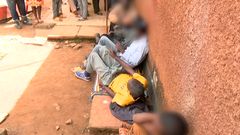 A crowd at the scene where several people died and others went blind after consuming illicit brew in Kirinyaga