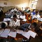 Kampala, UGANDA: Students at St. Denis' Secondary School in Ggaba, a suburb of the capital Kampala, study during the first lesson of the day 23 March 2007. The Ugandan government has recently launched the Universal Secondary Education (USE) programme w...